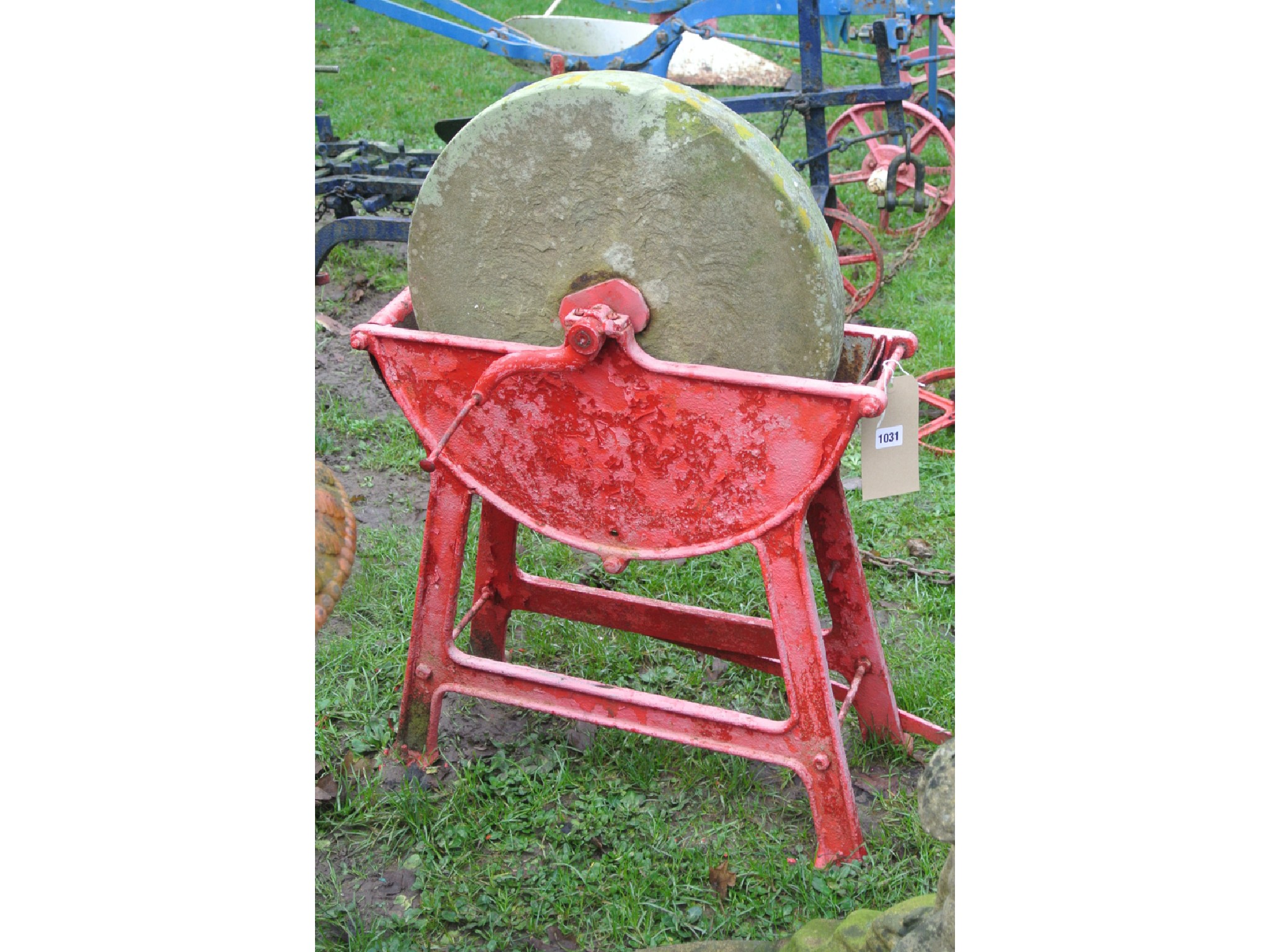 Appraisal: A vintage Sharpening stone raised cradled in a cast iron