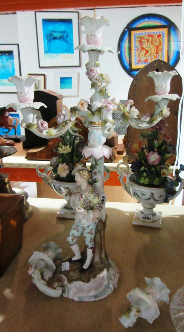 Appraisal: A German porcelain figural candelabra