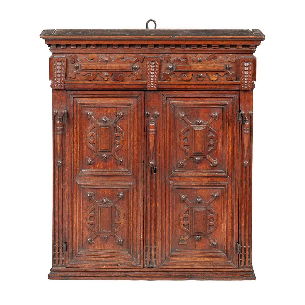 Appraisal: FLEMISH OAK HANGING CUPBOARD TH CENTURY the moulded cornice above