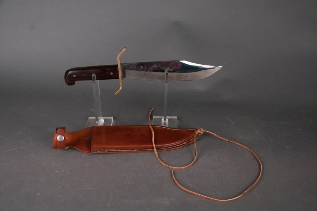 Appraisal: Bowie Knife in Sheath by Western Blade is bright Brass