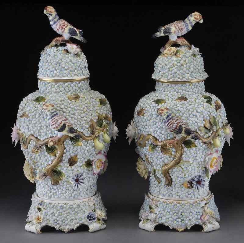 Appraisal: Pr Meissen style porcelain lidded urns the bodies encrusted with