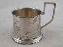 Appraisal: A Russian hallmarked silver tea glass holder with engraved decoration