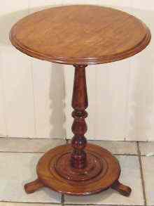 Appraisal: A Victorian mahogany occasional table the circular top on a