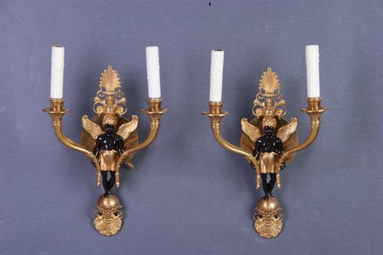 Appraisal: PAIR EMPIRE-STYLE GILT-METAL TWO-LIGHT SCONCES CAST AS BLACKAMOORS th century