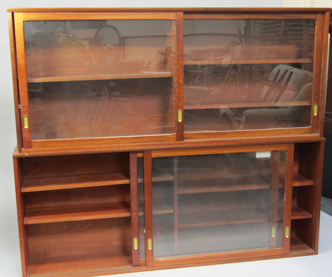 Appraisal: A pair of teak library bookcase each with two glazed