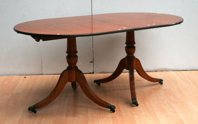 Appraisal: A Regency style mahogany extension double pedestal dining table with