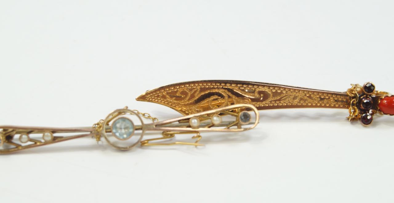 Appraisal: A bar brooch as a scimitar set with coral and