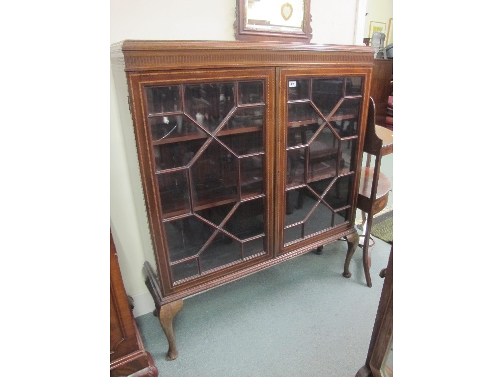 Appraisal: Edwardian mahogany inlaid glazed two door bookcase