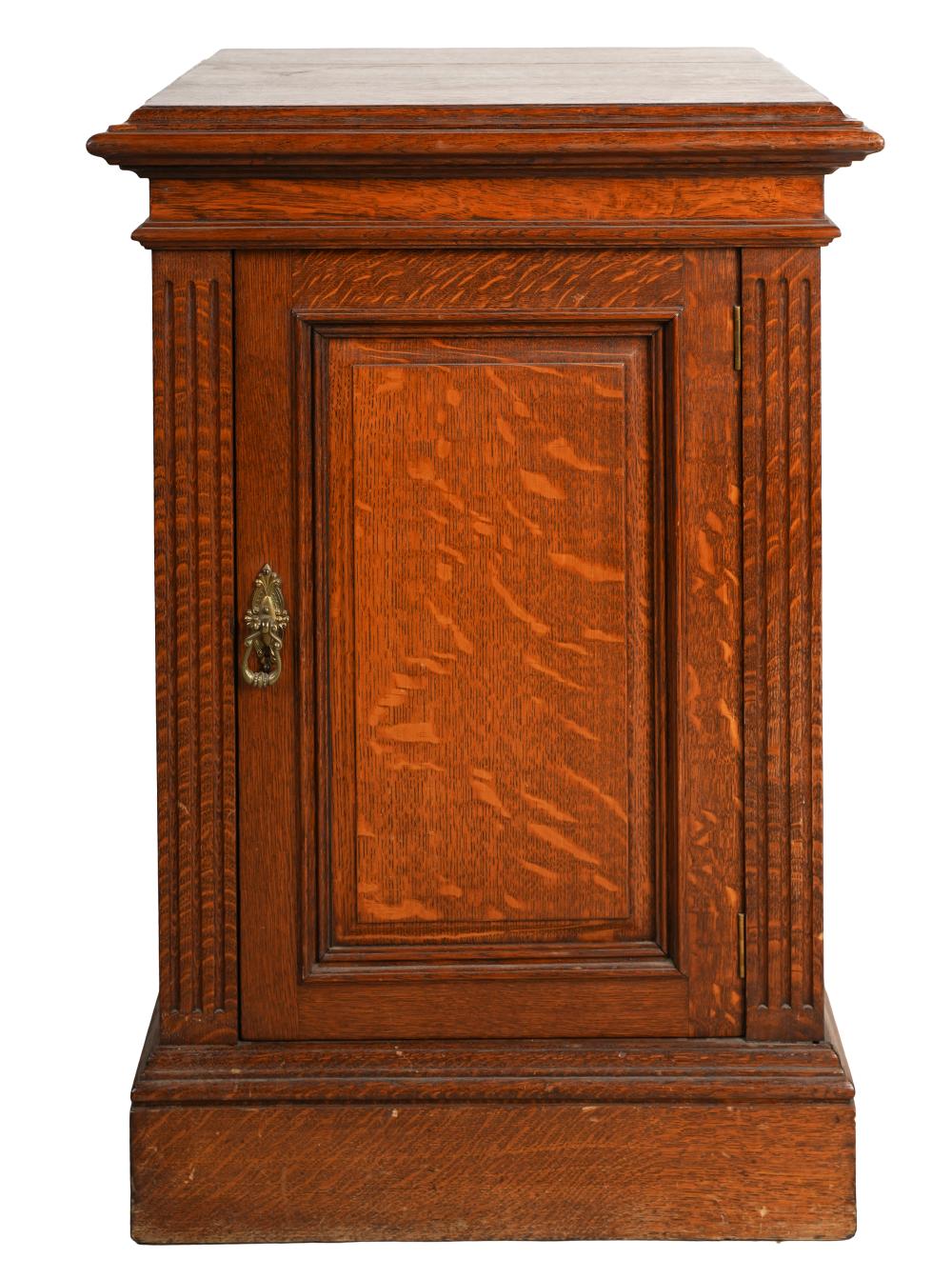 Appraisal: OAK PEDESTAL CABINETcirca having fluted stiles flanking a paneled door