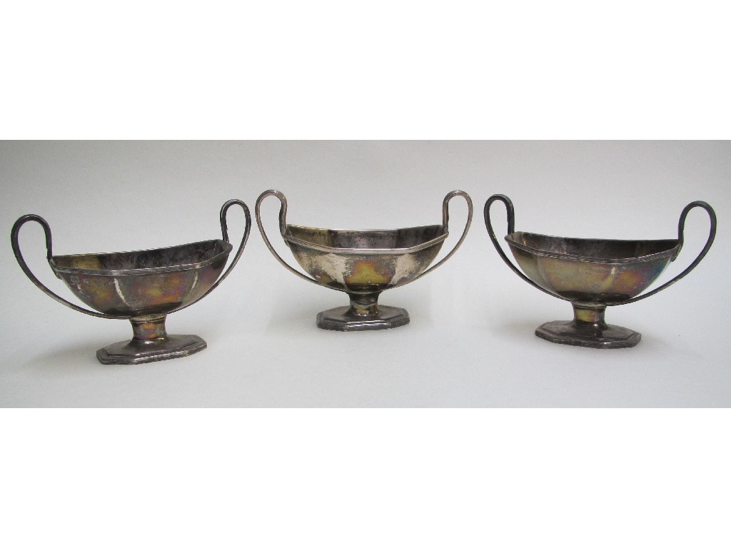 Appraisal: Three silver octagonal two handled salt cellars one with family