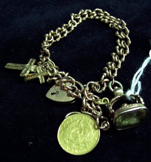 Appraisal: A fancy link chain bracelet with padlock clasp set two