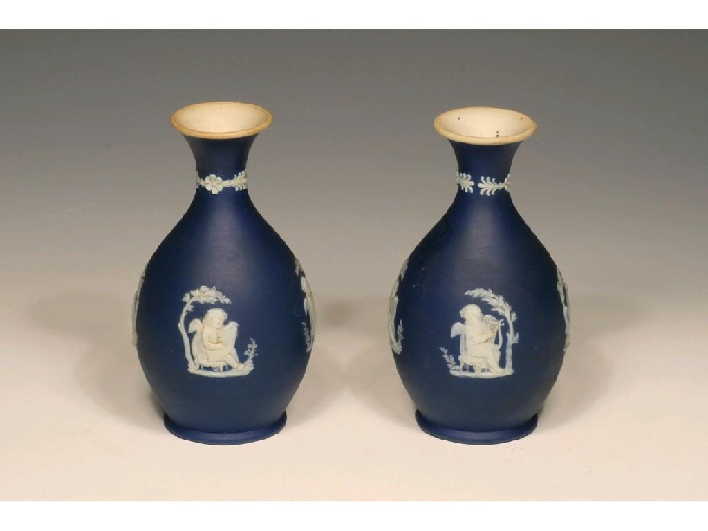 Appraisal: A PAIR OF WEDGWOOD JASPERWARE VASES of baluster form each