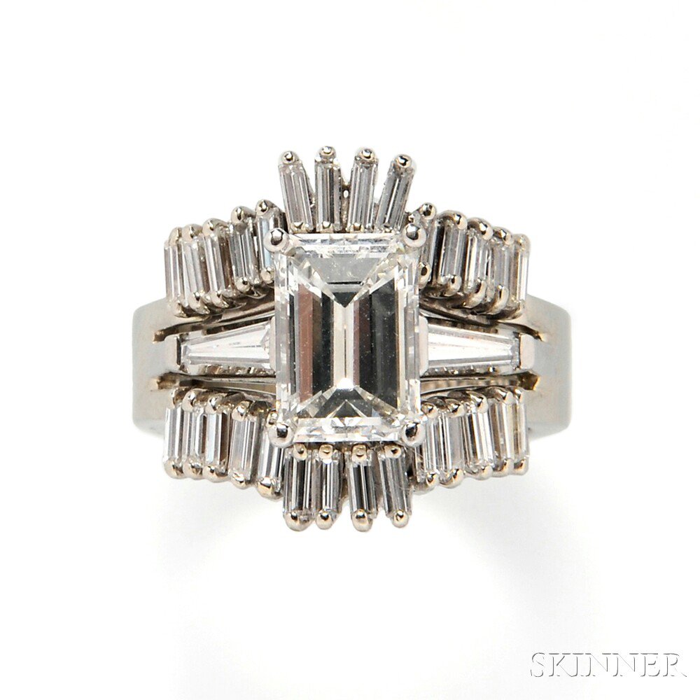 Appraisal: Diamond Solitaire prong-set with an emerald-cut diamond weighing cts flanked