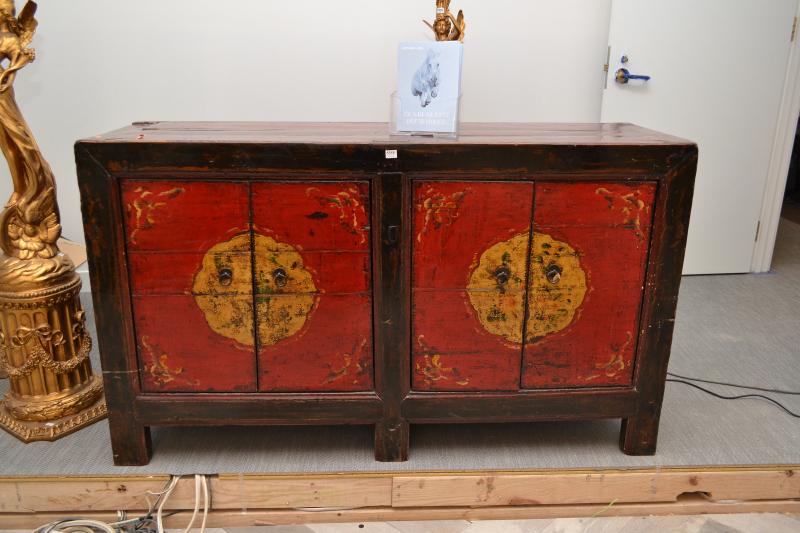 Appraisal: AN ORIENTAL SIDE CABINET IN GLAZED RED AND MUSTARD AN