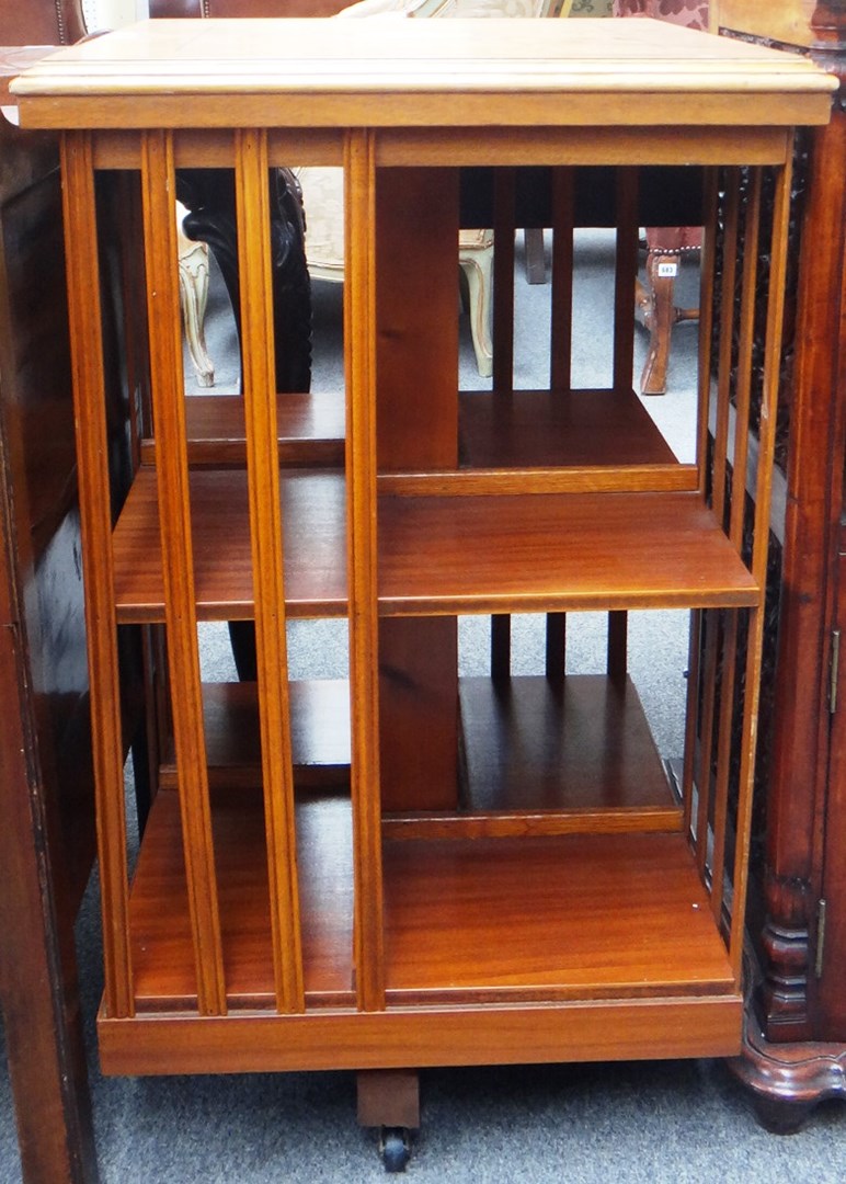 Appraisal: A marquetry inlaid satinwood revolving bookcase cm wide