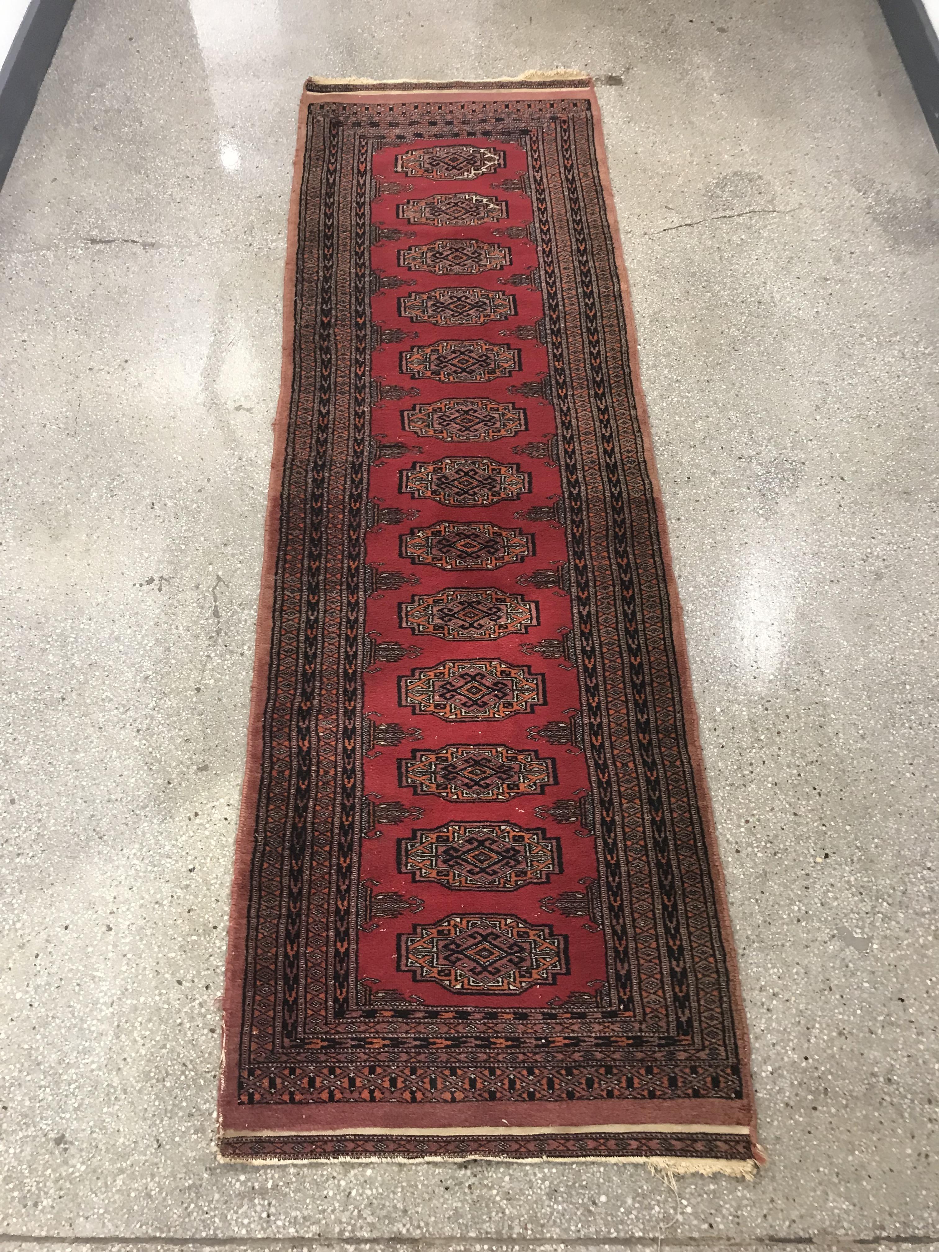 Appraisal: HAND-KNOTTED BOKHARA RUNNER RUG Hand-knotted Bokhara wool runner rug with