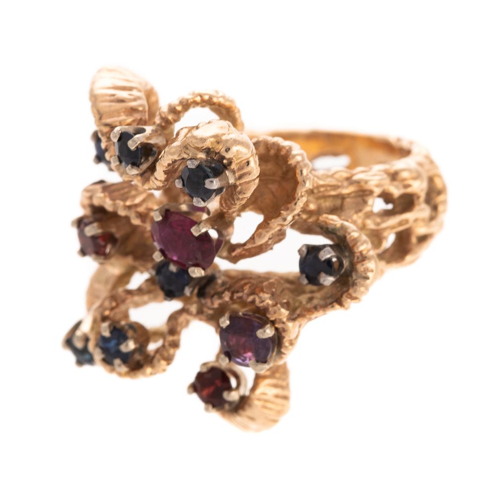 Appraisal: A Textured Sapphire Ruby Ribbon Ring in K K yellow