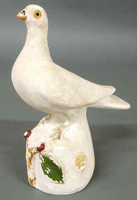 Appraisal: Pennsylvania chalkware dove c perched on an orb with cherry