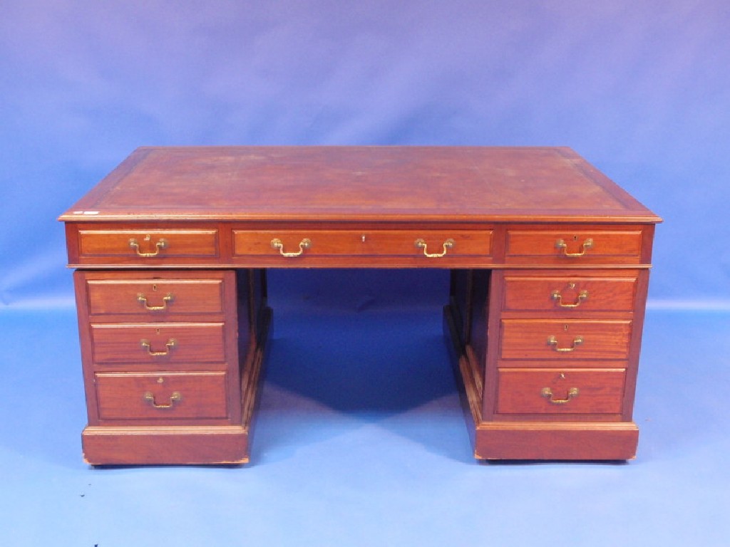 Appraisal: An early thC panelled mahogany partners desk with leather inset