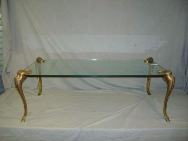 Appraisal: Midcentury decorative glass coffee table with gilt metal legs From