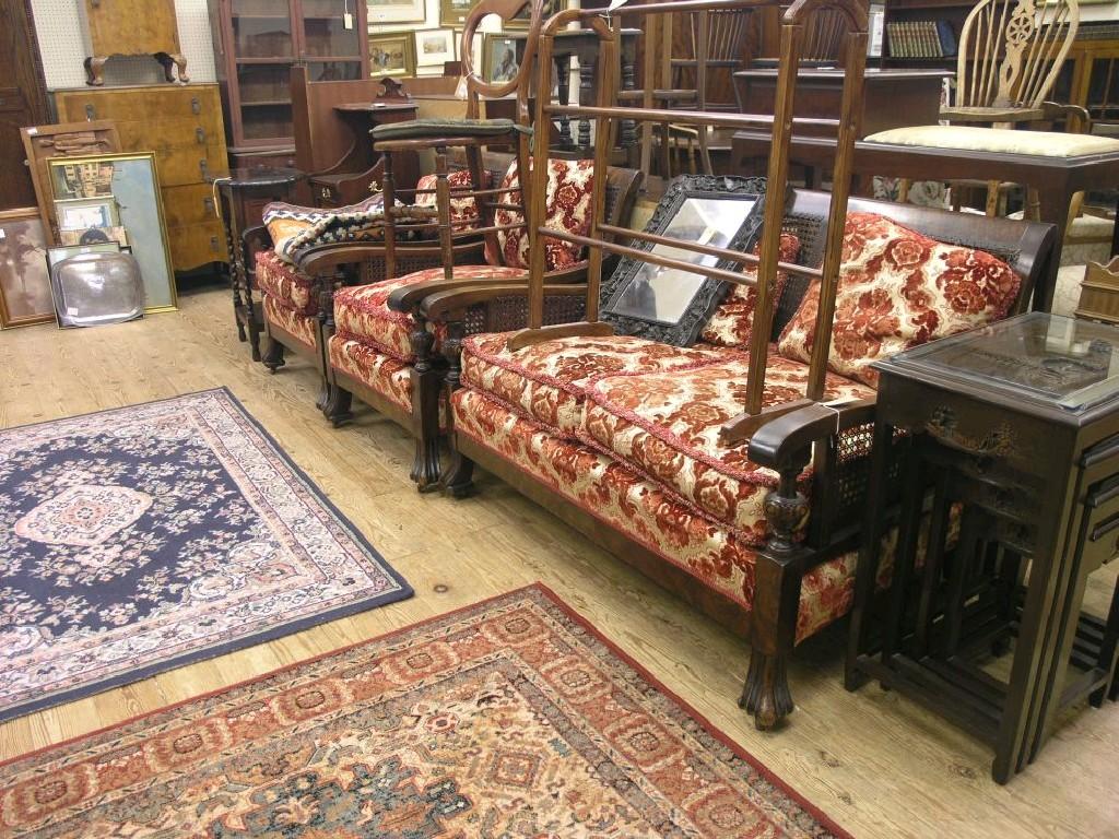 Appraisal: An early th century walnut-framed bergere suite two-seater settee and