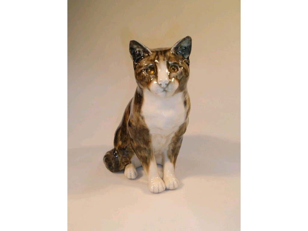 Appraisal: A pottery model of a seated tabby cat by Mike