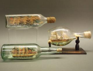 Appraisal: Ships in Bottles Three early th century Ships in glass