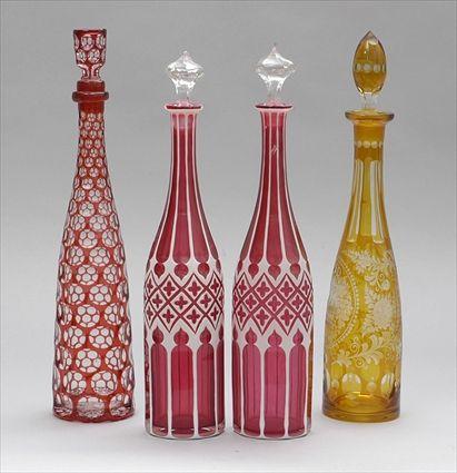 Appraisal: PAIR OF OVERLAY CRANBERRY GLASS DECANTERS AND STOPPERS AND TWO