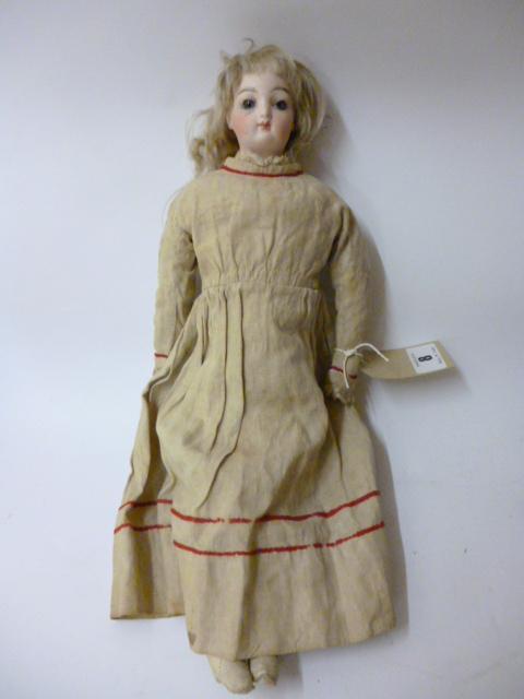 Appraisal: A French bisque head and shoulders doll of fashion type