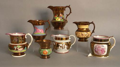 Appraisal: Seven copper luster pitchers th c h tallest