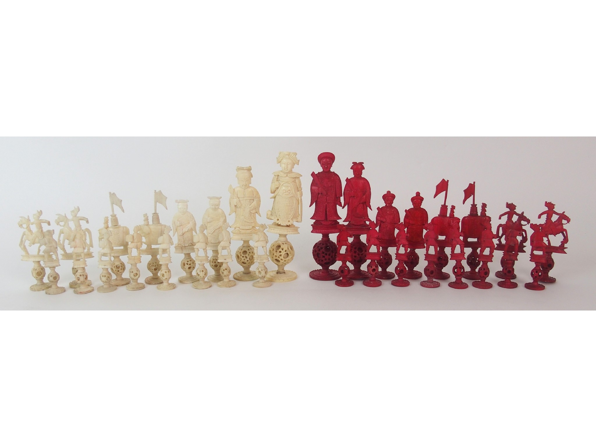 Appraisal: A Chinese ivory chess setcarved with each figure on a