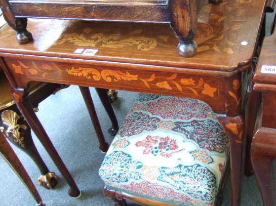 Appraisal: A Dutch marquetry card table circa the fold over top