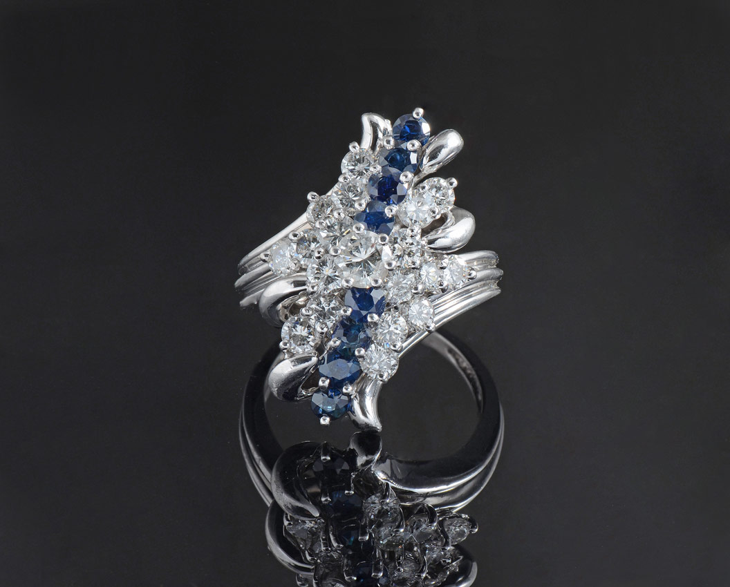 Appraisal: DIAMOND RING WITH A ''WATERFALL'' OF SAPPHIRES K white gold