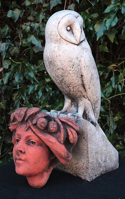 Appraisal: A CAST COMPOSITE LIFE SIZE BARN OWL cm together with