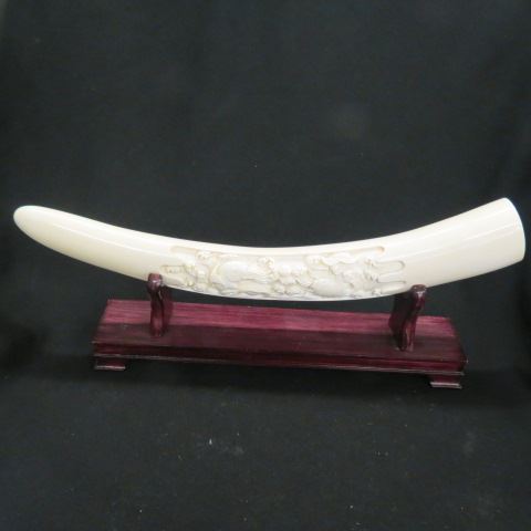 Appraisal: Chinese Carved Ivory Tusk coy wave design long custom stand