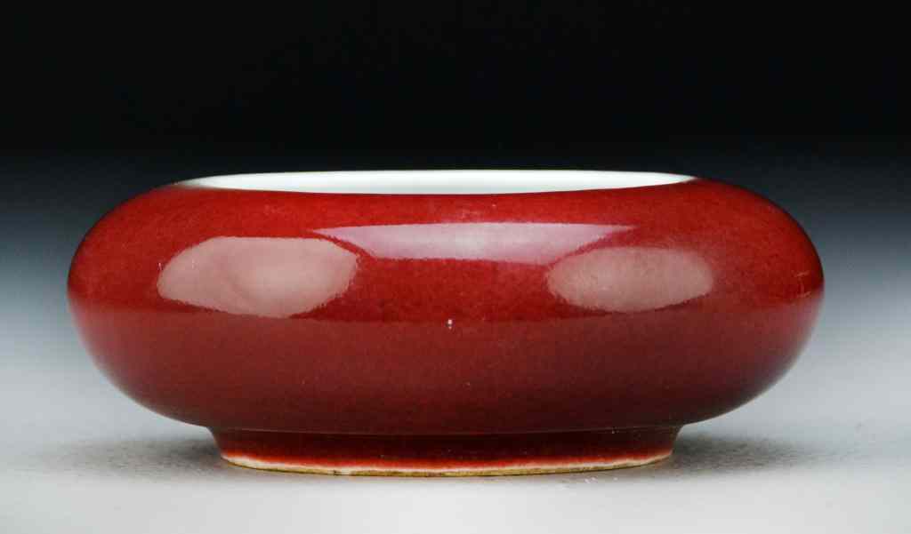 Appraisal: Chinese Monochrome Porcelain BrushwashHaving strawberry glaze raised on short foot