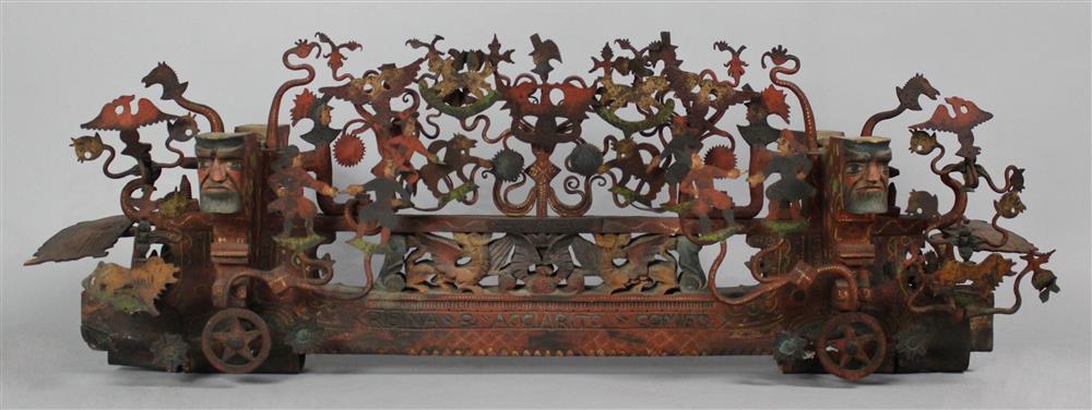 Appraisal: SICILIAN WROUGHT IRON CARVED AND PAINTED WOOD CART AXEL ORNAMENT