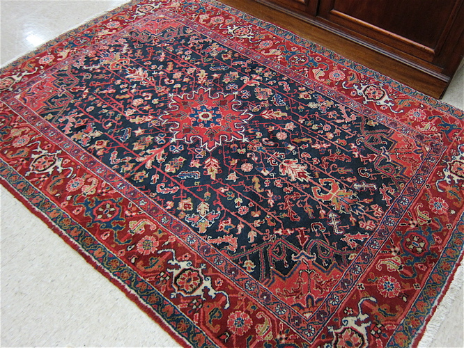 Appraisal: PERSIAN AREA RUG hand knotted in a stylized floral vine