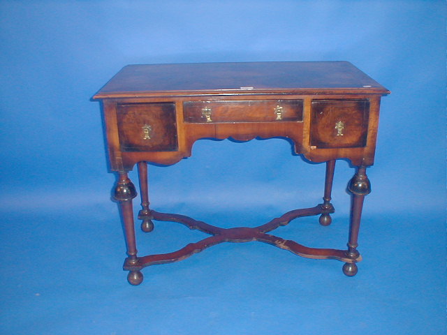 Appraisal: An early thC cross banded walnut side table with three