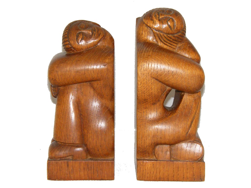 Appraisal: Pair of Arts Crafts oak bookends modelled as stylised crouching