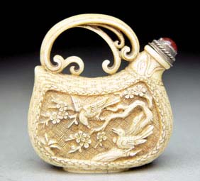 Appraisal: CARVED IVORY SNUFF BOTTLE Superbly detailed carved ivory snuff bottle