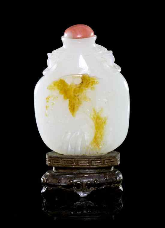 Appraisal: A White Jade Snuff Bottle with Russet Skin of compressed