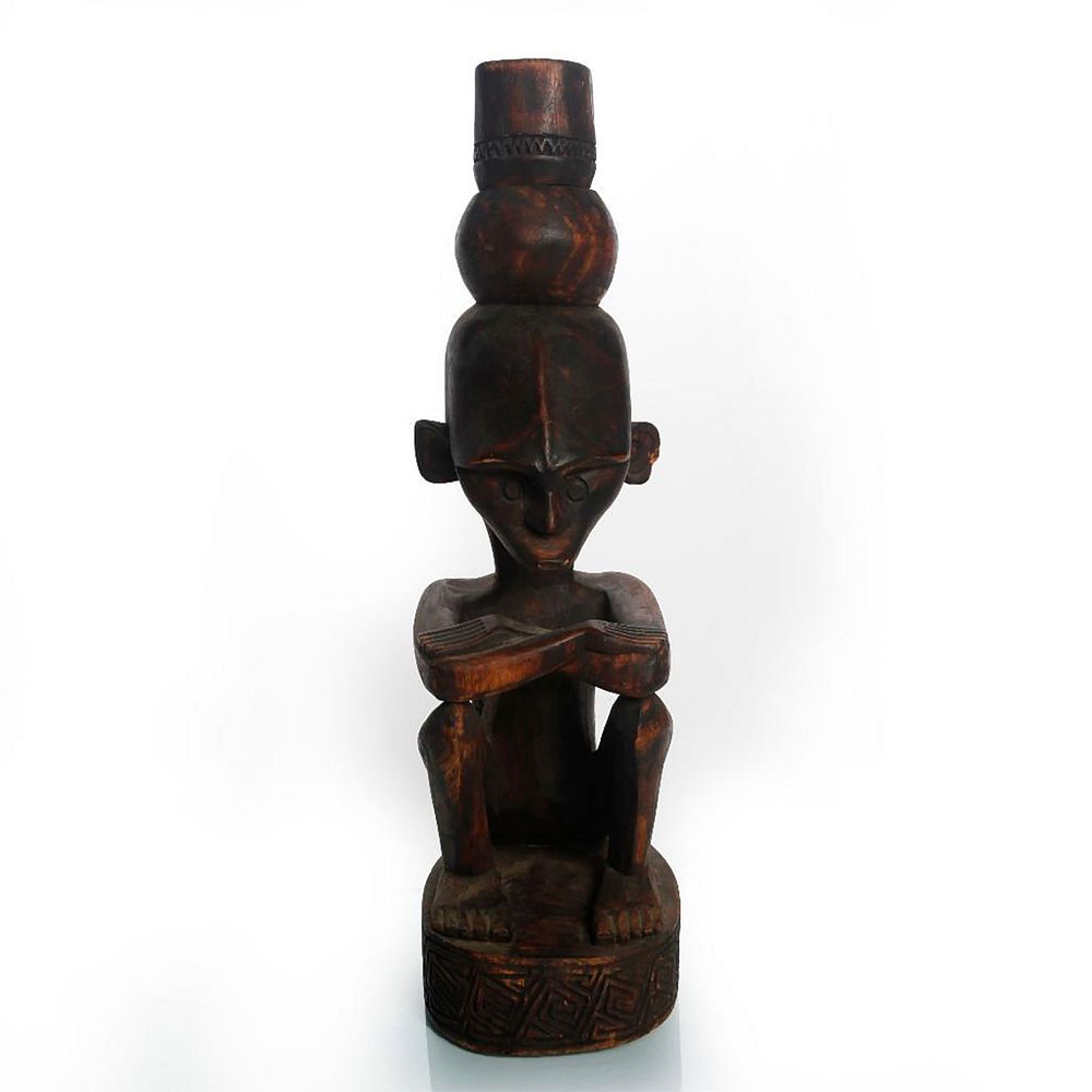 Appraisal: VINTAGE AFRICAN WOODEN SCULPTURE OF MAN SITTING Traditional African wooden