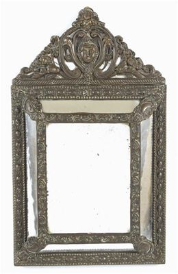 Appraisal: A continental rectangular wall mirror with an embossed copper frame