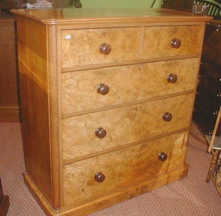 Appraisal: A Victorian walnut chest of two short and three long