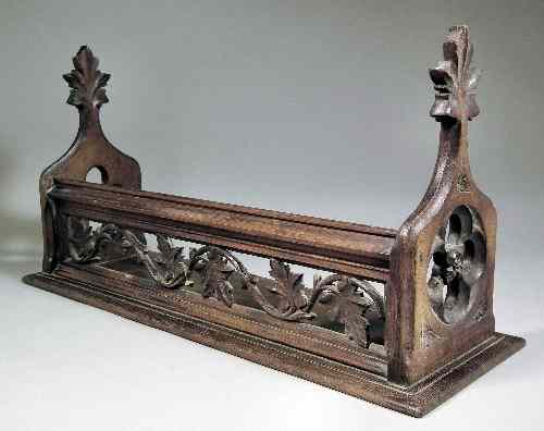 Appraisal: A th Century carved oak book trough of ''Gothic'' design