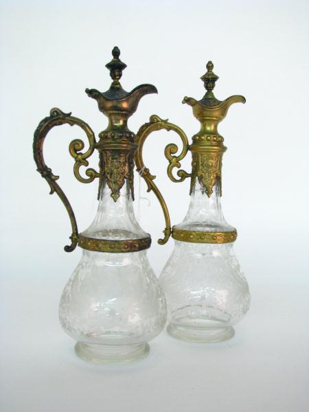 Appraisal: Pair of Etched Crystal Ewers with ornate cast metal handle