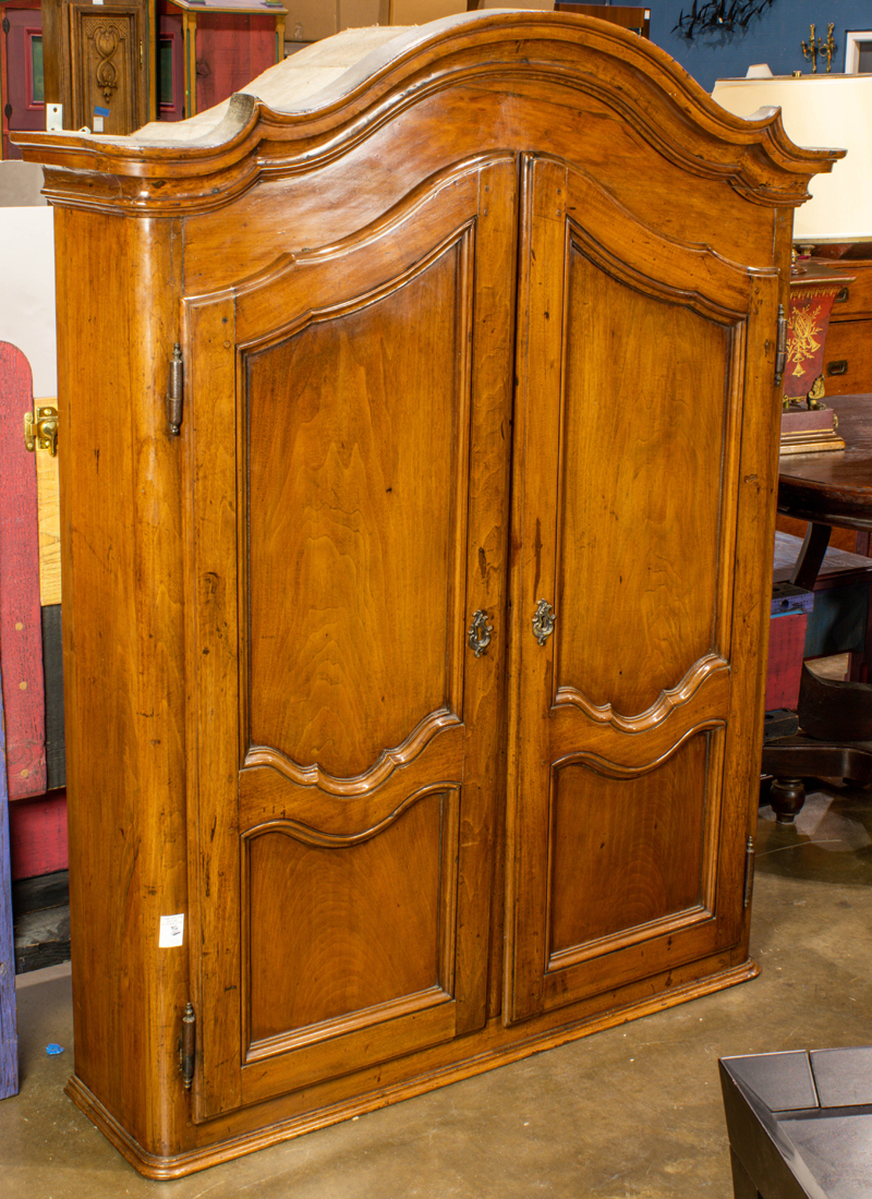 Appraisal: AN ITALIAN BAROQUE STYLE WALNUT CABINET An Italian Baroque style