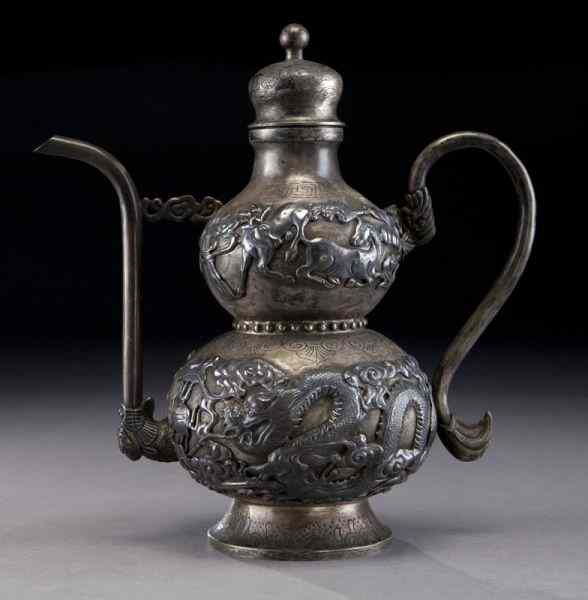 Appraisal: Chinese silver wine pot depicting dragonsand cranes ''H x ''W