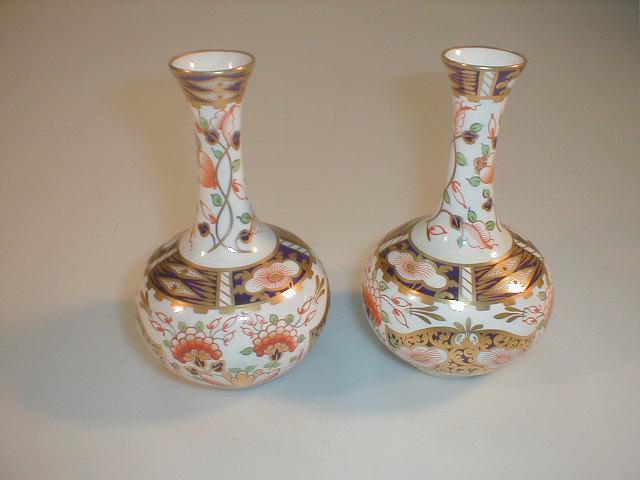 Appraisal: A pair of Stevenson and Hancock Derby porcelain bottle vases